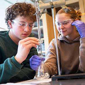 Photo of two students working together in science class. Read about What to Give