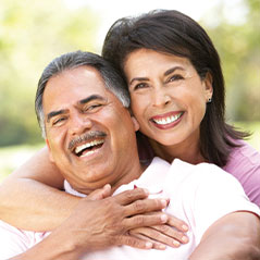 Middle aged couple smiling and laughing