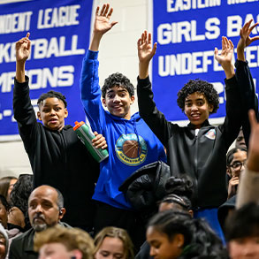 Photo of a trio of students standing and cheering in bleachers. Read about Gifts That Pay You Income