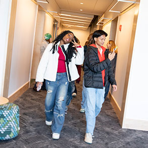 Photo of a couple of students walking down a hallway. Read about Tangible Personal Property